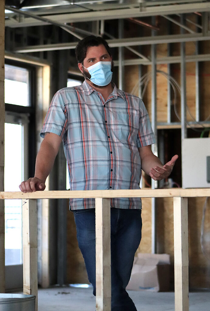 Bryan Maness, owner of the up-and-coming Ozark Mountain Biscuit Co. restaurant, talks about the construction plans on Friday in Columbia.